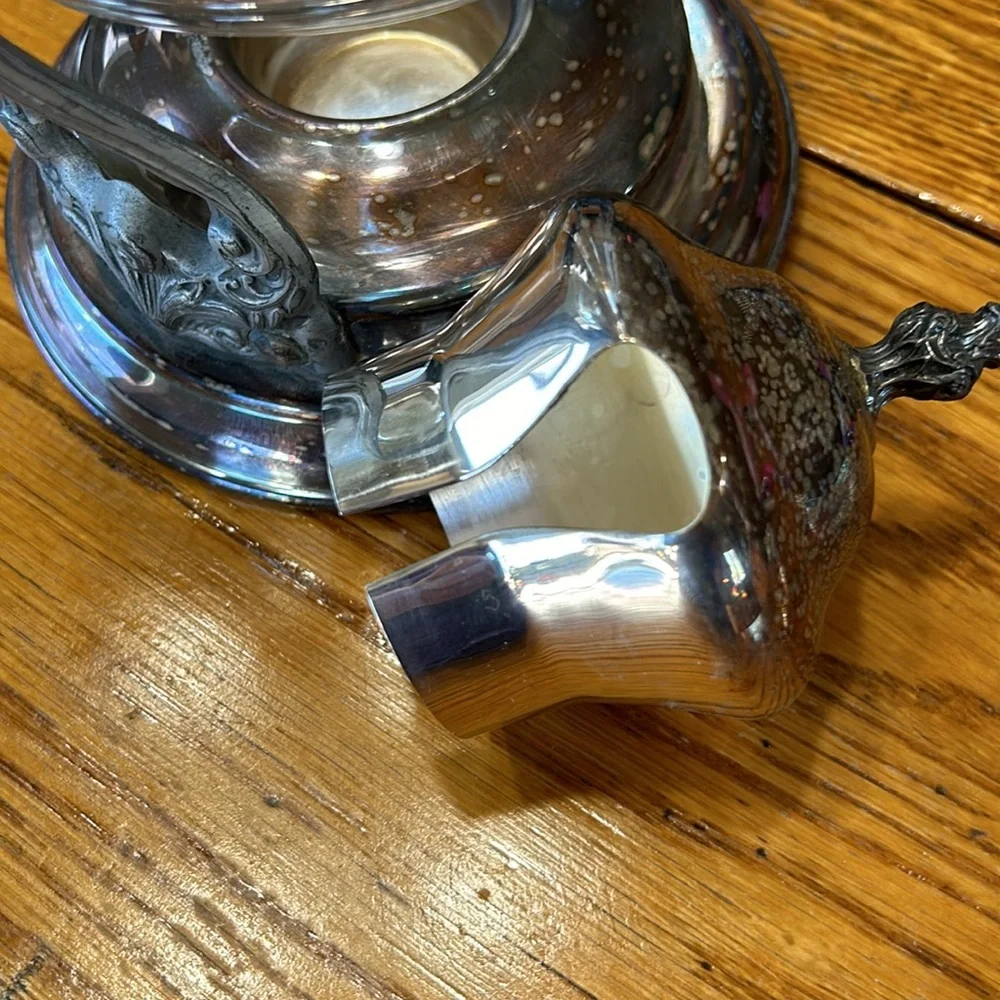 Vintage silver plated tilting coffee stand and carafe. No markings. Glass carafe